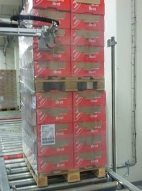 Labeller applying label to package