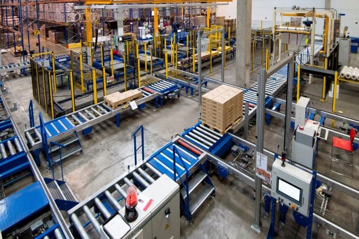 Boxes on conveyor belts in warehouse