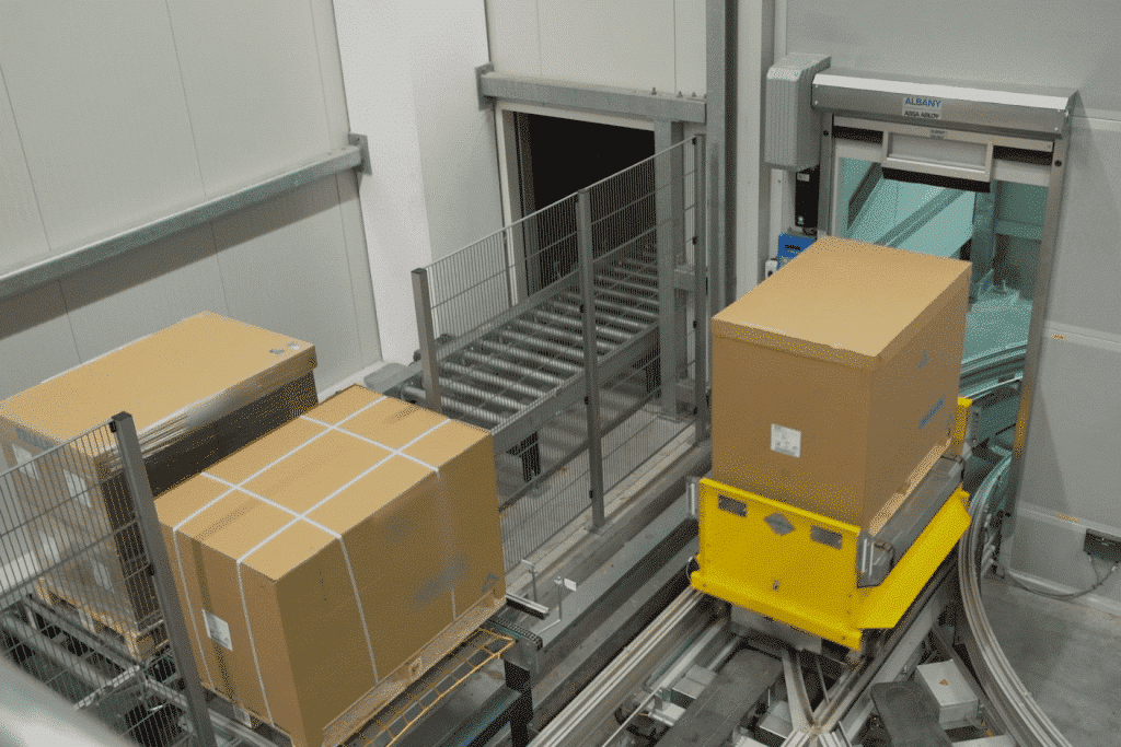 Rail guided vehicles transporting packages