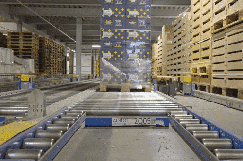 Stacked boxes with shipping conveyor