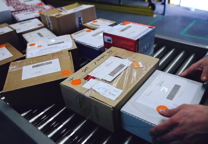 Packages being manually handled and sorted