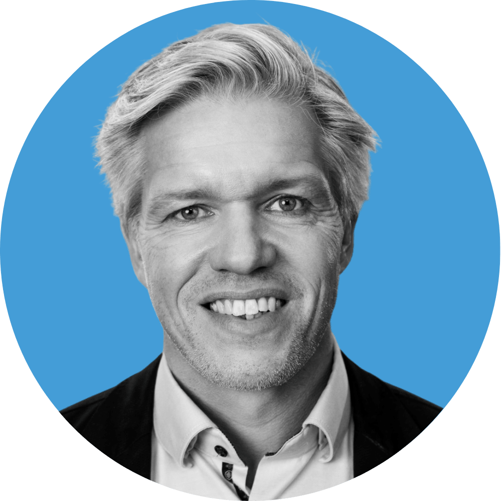 Headshot of Thierry Canevet on blue circle